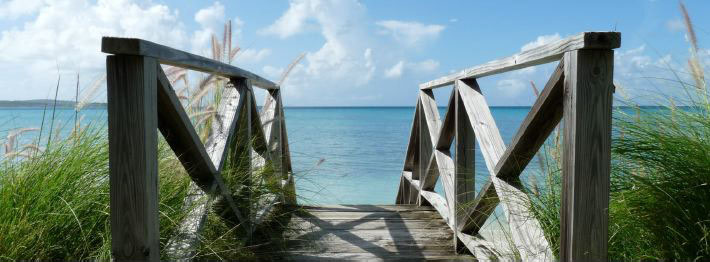 Wooden bridge to Caribbean beach